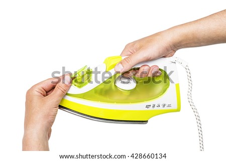 hand holding nice modern green iron on white back, close up electronic ironing isolated background, iron clothing appliance housework steam tool laundry household heat electricity 