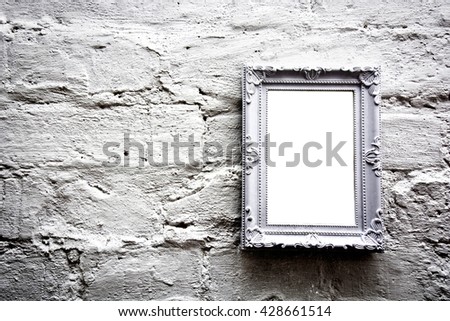 White empty frame with free copy space on white grunge brick wall. Grunge picture.