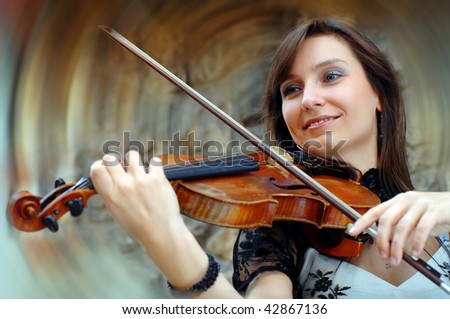 Playing violinist on the grunge background