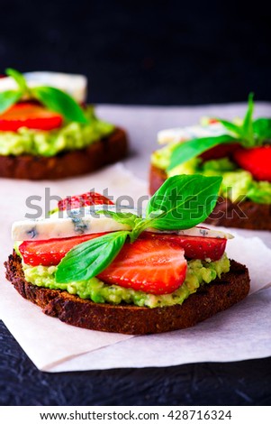 Sandwich with strawberry on white craft paper