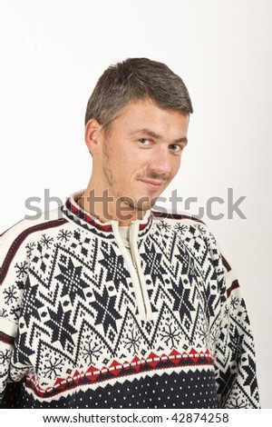 Young handsome man in warm winter clothes