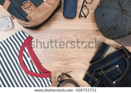 Flat lay photography of men's casual outfits, Outfits of traveler, boy, male, Men's casual outfits on wood board background - Vintage effect style picture