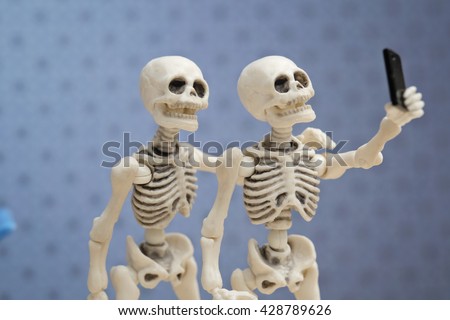 Selfie, self portrait with skeletons