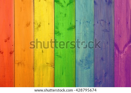 Background from multicolored boards in colors of rainbow. Wooden texture. Colorful pattern. Modern fence Royalty-Free Stock Photo #428795674