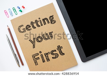 Text Getting your first on white paper book on table. business concept.