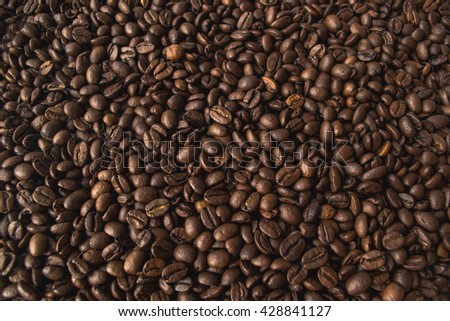Roasted Arabic coffee. Whole coffee beans, a nice brown color if emit the smell. Photos can be used as texture, background, for a variety of image editors, menus and 