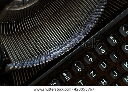 close up of black typewriter - studio shot from above - natural light - vintage object