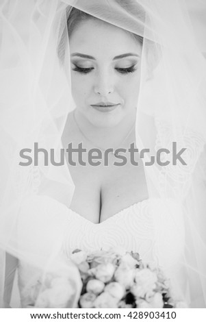 Dreaming bride with bouquet. Happy wedding day
