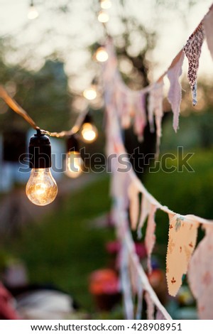 cute garland of colored flags and light bulbs