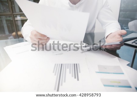 Marketing Department Work Process.Photo Trader working Online Report Documents Touching Tablet,Reflections Screen.Using Graphics,Stock Exchanges Files. Business Project Startup. Horizontal