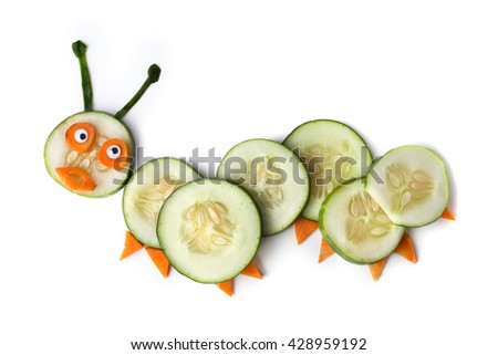 Food art creative concepts. Cute caterpillar made of cucumber and carrots isolated on a white background.