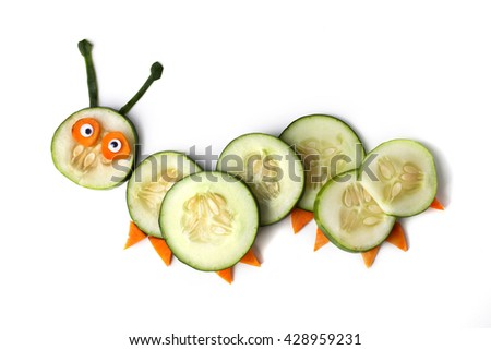 Food art creative concepts. Cute caterpillar made of cucumber and carrots isolated on a white background.