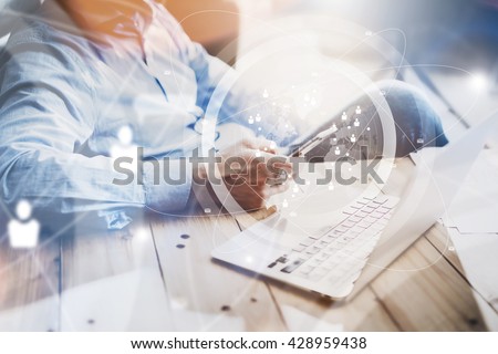 Office life,time brake.Businessman working loft New Project.Using smartphone,modern notebook wood table.Man relaxing during work day.Digital Connections World Wide Interfaces.Horizontal, film effect Royalty-Free Stock Photo #428959438