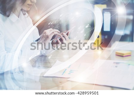 Image business woman wearing white shirt, sending message smartphone.Open space loft office.Report documents,blurred background.Connections world wide interfaces.Horizontal,flares.Film effect