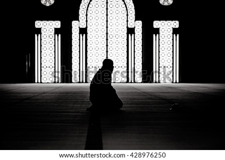 Muslim praying in a mosque Royalty-Free Stock Photo #428976250