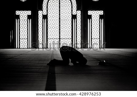 Muslim praying in a mosque Royalty-Free Stock Photo #428976253
