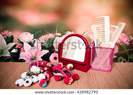 mirror ,accessories and comp set with florist with blur bush background Royalty-Free Stock Photo #428982790