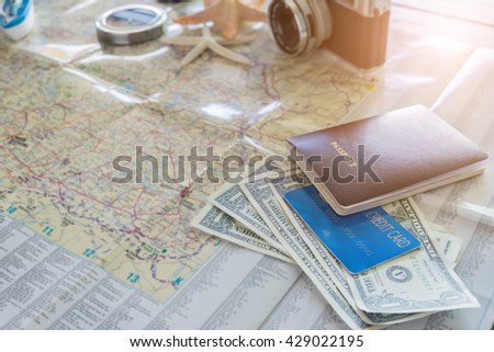 International travel concept. Passport, boarding pass, money, credit card, camera and compass