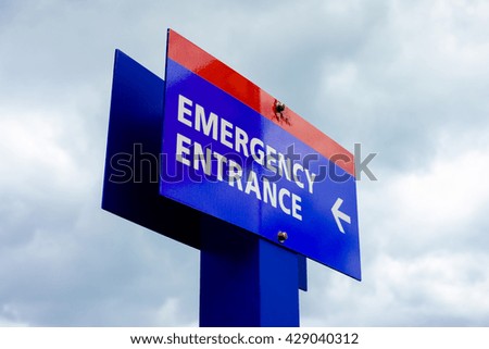 Close up view of a colorful hospital emergency room sign.