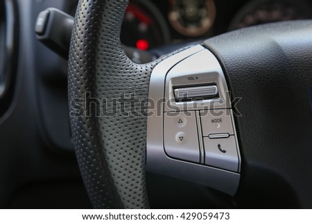 Sound audio music and phone function control button on the left hand side of car steering wheel.

