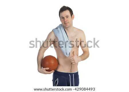 Topless sportsman with a ball in his hand