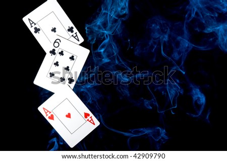 Background with playing cards on black background