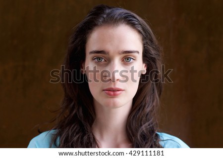 Close up portrait of attractive young woman with long hair  Royalty-Free Stock Photo #429111181