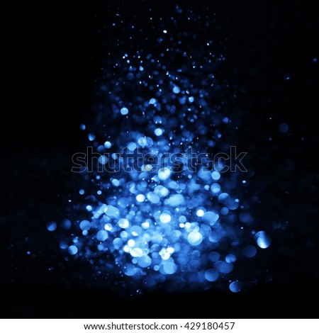 Blue Festive Christmas elegant abstract background with bokeh lights and stars. Christmas card