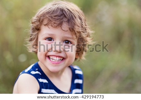 A happy kid smiling and laughing Royalty-Free Stock Photo #429194773