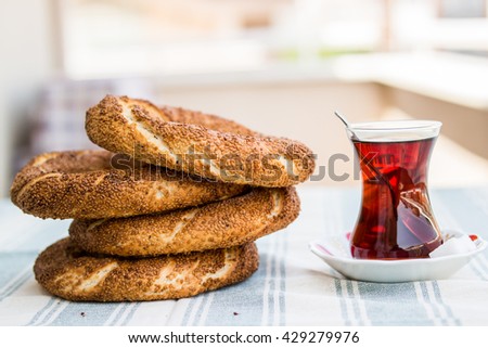  simit and tea on a blue tablecloth in the  balcony at home front view Royalty-Free Stock Photo #429279976