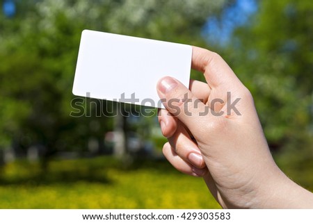Hand with card vivid