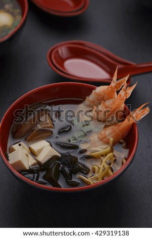 Japanese cuisine.Miso soup set over black background.