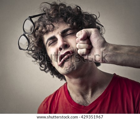 Getting punched in the face Royalty-Free Stock Photo #429351967