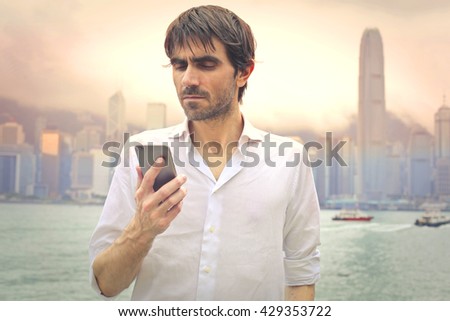 Man in Hong Kong using his smartphone