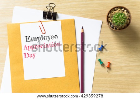 Employee Appreciation Day, message on the white paper / business concept / wood desk , copy space / business concept / view from above, top view Royalty-Free Stock Photo #429359278