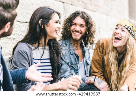 Group of four friends laughing out loud outdoor, sharing good and positive mood Royalty-Free Stock Photo #429419587