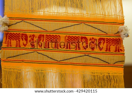 Yellow Lanna Thai northern style flag with red four elephants symbol, close up picture