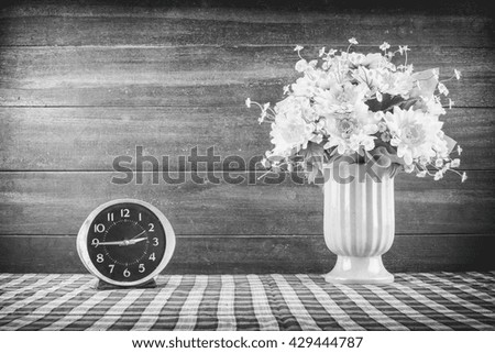 Desk clocks and vases of flowers./ Customize them the picture retro./ Create noise and scratches./ Make the image look retro.