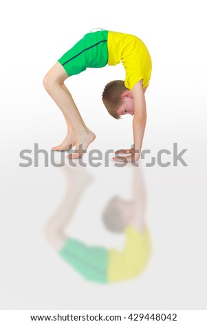 little girl doing yoga on white background