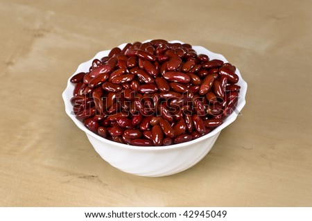 Beans in bowl on wooden table Royalty-Free Stock Photo #42945049