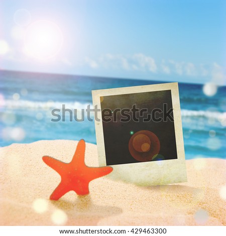 Retro Instant photo on beach sand In summer.