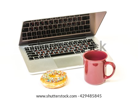 Coffee break with laptop and glazed donut isolated on a white background