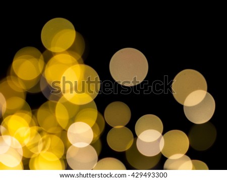Real golden lens artifacts on a black background.