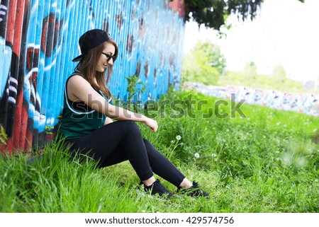 young woman sitting in the park
