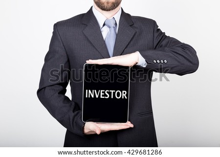 technology, internet and networking in business concept - businessman holding a tablet pc with investor sign. Internet technologies in business