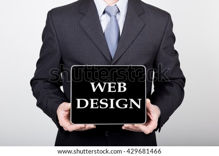 technology, internet and networking in business concept - businessman holding a tablet pc with web design sign. Internet technologies in business