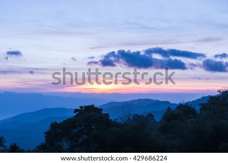 Mountain complex and colorful sky for background.