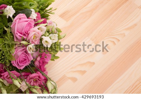 Closeup picture of beautiful bouquet of flowers represented on wooden background. Copyspace may be used for your emotions in Valentine's Day.
