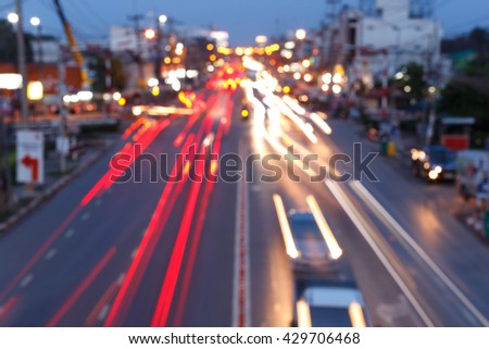 The light trails on the street in the city.Long exposure.Motion of light car in evening time with traffic jam.