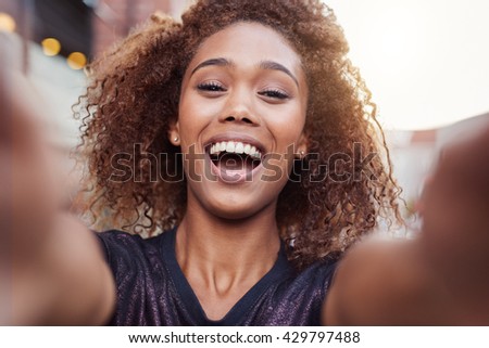 Filling her selfie with laughter